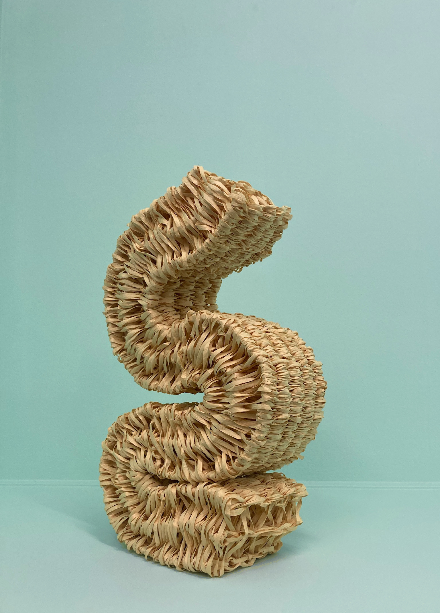 Yellow woven sculpture in paper yarn made 2023 by Emilia Elfvik. 